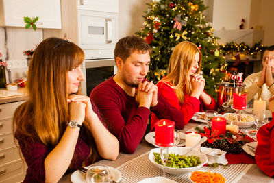 Group of people sitting in restaurant