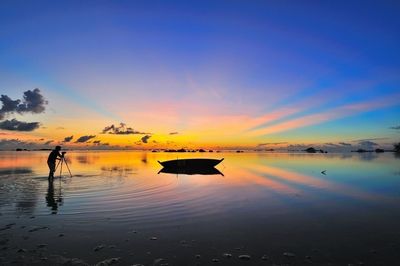 Scenic view of calm sea at sunset