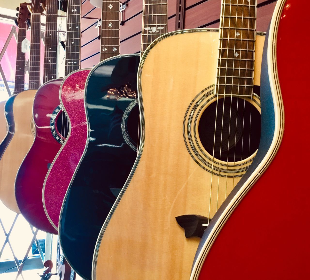 CLOSE-UP OF GUITAR IN SHOPPING CART