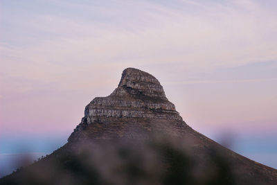 Low angle view of rock mountain against sky