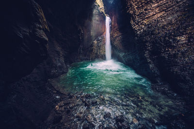 Kozjak waterfall in a cave near kobarid, soca valley, slovenia.