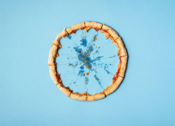 Directly above shot of bread against blue background