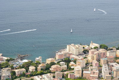 High angle view of buildings by sea