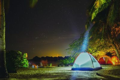 Illuminated tent against sky at dampalitan beach