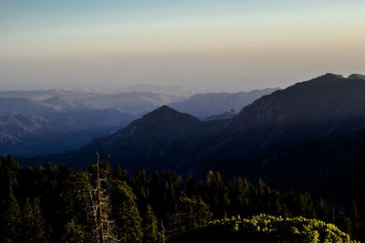 Scenic view of mountains against sky at sunset