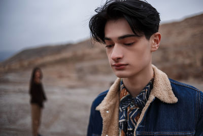 Portrait of young man looking away