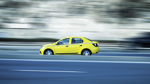 Yellow car on road