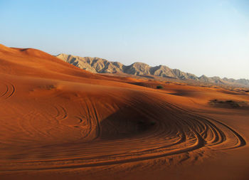 Scenic view of desert against clear sky