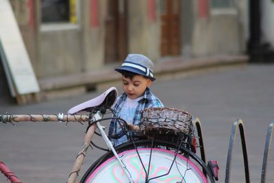 Boy riding motorcycle on street