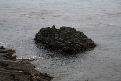 High angle view of rock formation on sea