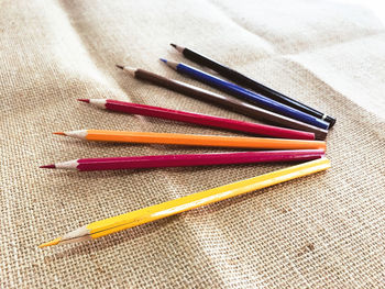 High angle view of colored pencils on table