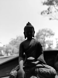 Statue of buddha against sky