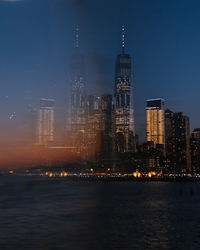 Illuminated buildings in city at night