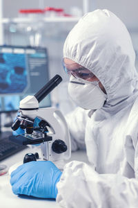 Scientist holding dentures in laboratory