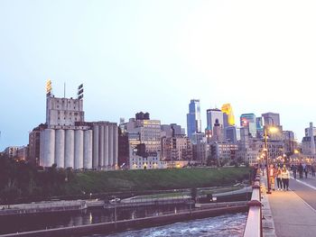 Buildings in city against clear sky