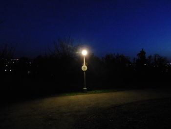 View of illuminated street light at night