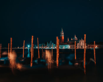 Illuminated buildings in city at night