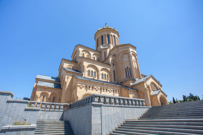 Low angle view of building against clear blue sky