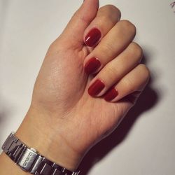Close-up of woman hand over white background