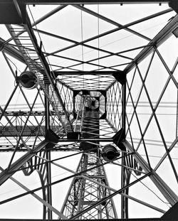 Directly below view of metallic electricity pylon