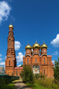 Low angle view of church against blue sky