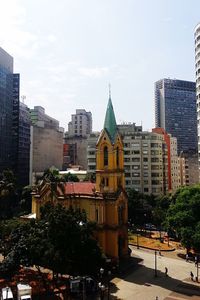 Buildings in city against sky