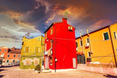 Buildings against sky during sunset