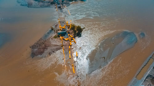 High angle view of damaged bridge in flood