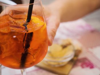 Close-up of hand holding drink