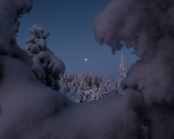 Low angle view of snow on mountain against sky