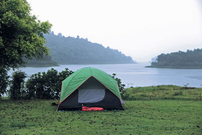 Tent on field against sky