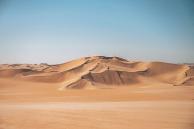 Scenic view of desert against clear sky