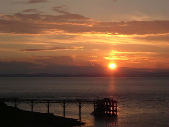 Scenic view of sea at sunset