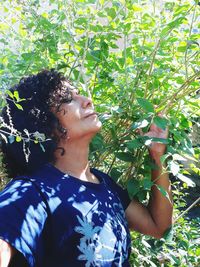 Midsection of woman against plants