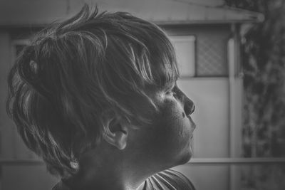 Close-up portrait of a man looking away at home