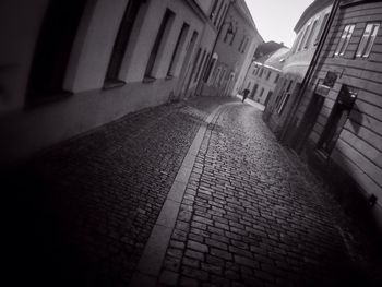 Narrow alley with buildings in background