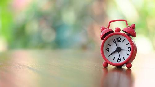 Close-up of clock on table