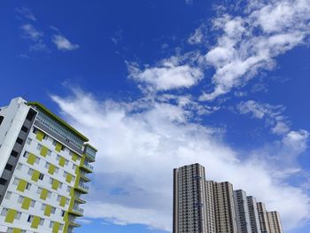 Low angle view of modern buildings against sky