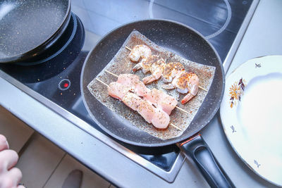 High angle view of meat in cooking pan