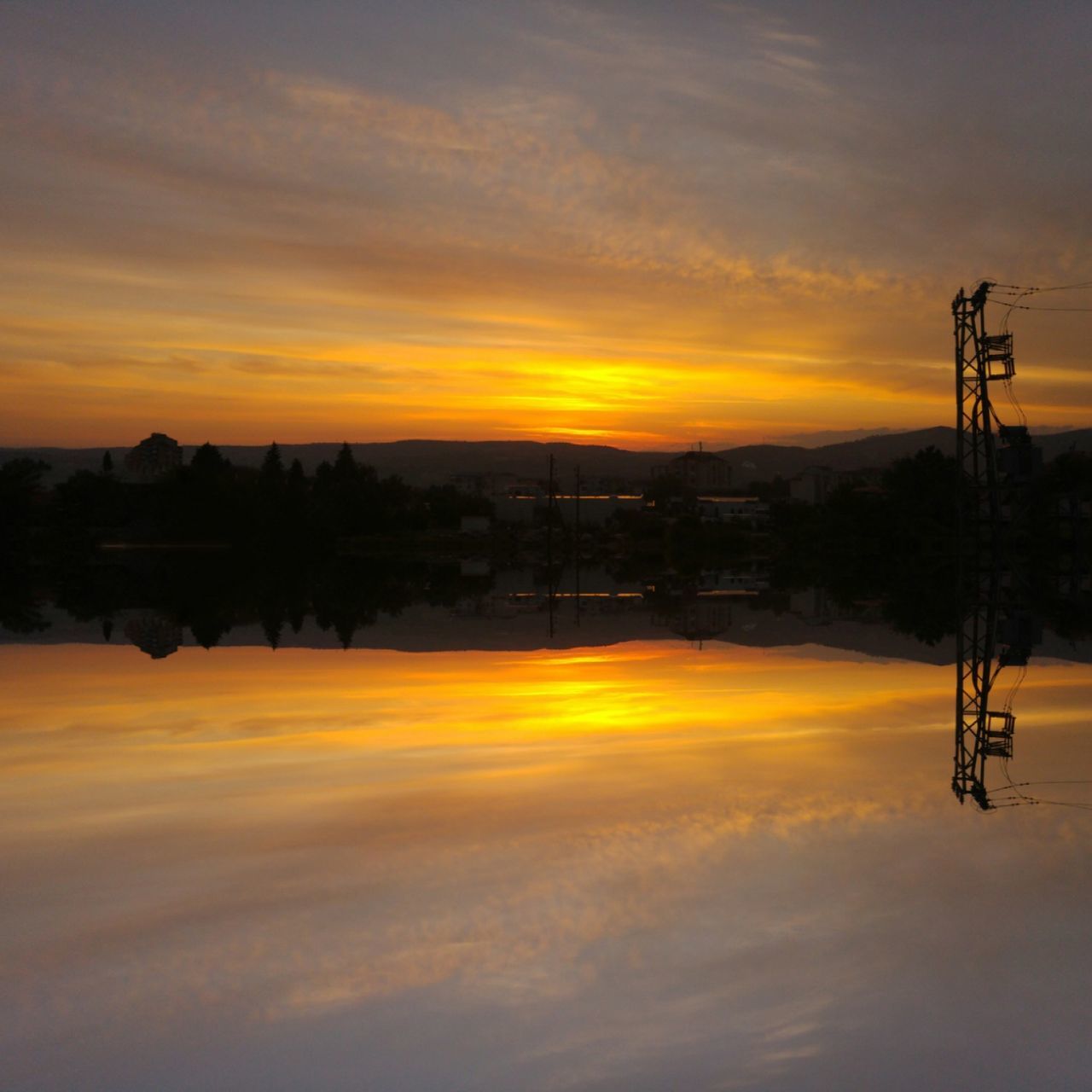 SILHOUETTE OF BUILDINGS AT SUNSET