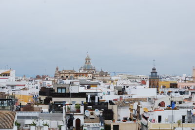 View of buildings in city against sky