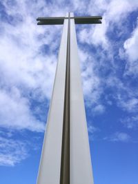 Low angle view of cross against sky
