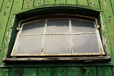 Low angle view of weathered window
