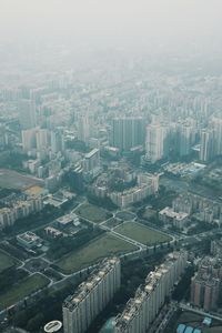 High angle view of buildings in city against sky