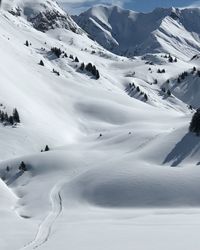 Scenic view of snow covered mountains in lech