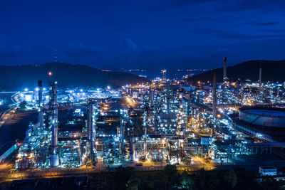 High angle view of illuminated buildings in city at night