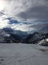 Scenic view of snowcapped mountains against sky