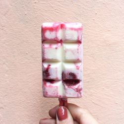 Close-up of hand holding ice cream