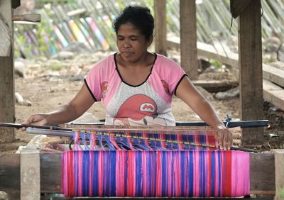 Portrait of woman sitting at market