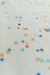 High angle view of multi colored candies on table